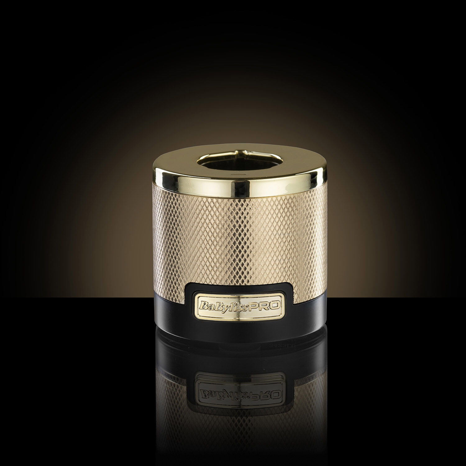 Gold Dual-voltage universal battery charging base on a dark background